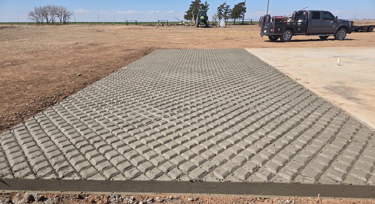 New concrete ramp with a raised grip texture for a cattle wash chute near Tulia